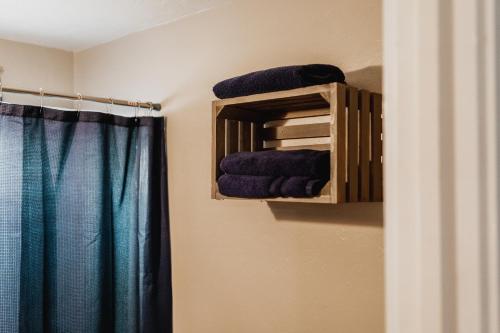 a bathroom with a towel rack with blue towels at Near Lake Texoma Quad-plex - 28 in Mead