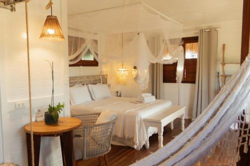 Ένα ή περισσότερα κρεβάτια σε δωμάτιο στο Kitejuba Bungalows