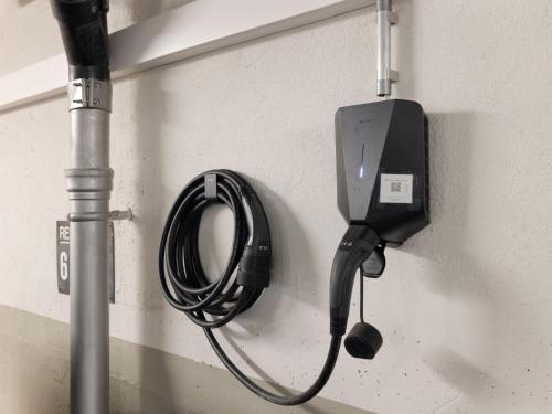a hose hooked up to a phone on a wall at Apartment Promenade - Utoring-68 by Interhome in Arosa