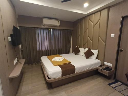 Hotel Royal Inn Lodging And Boardingにあるベッド