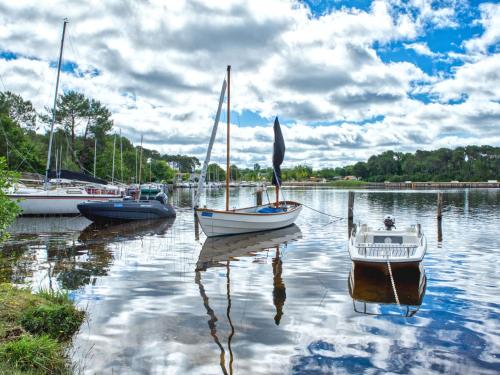 a group of boats docked in a body of water at Apartment Les Océanides-14 by Interhome in Lacanau-Océan