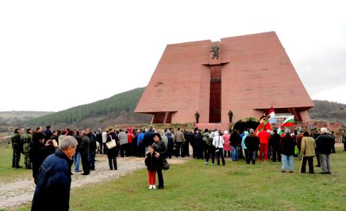 a large group of people standing in front of a church at Hotel Aleksievata Kashta in Gurgulyat