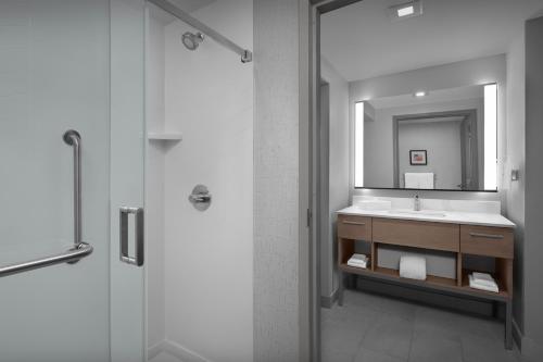 a bathroom with a sink and a mirror at Homewood Suites by Hilton Princeton in Princeton