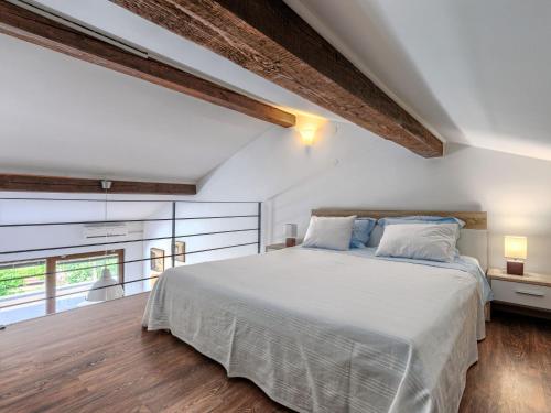 Postel nebo postele na pokoji v ubytování Apartment Olivo-1 by Interhome