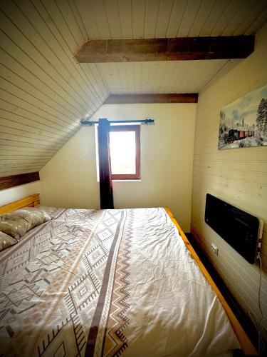 a large bed in a room with a window at White House Žabljak in Žabljak