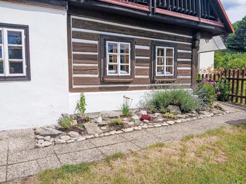 a garden in front of a house at Holiday Home Lánov by Interhome in Horní Lánov