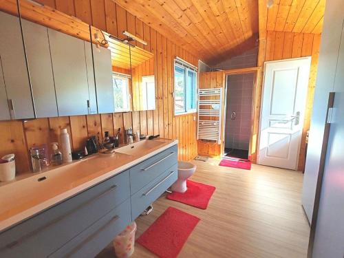 a large bathroom with a sink and a toilet at Villa JANE vue Bassin in Lège-Cap-Ferret