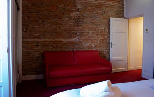 Postel nebo postele na pokoji v ubytování Le Clocher de Rodez Centre Gare