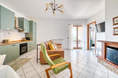 a living room with a couch and a fireplace at Umbria Casavacanze in Montefranco
