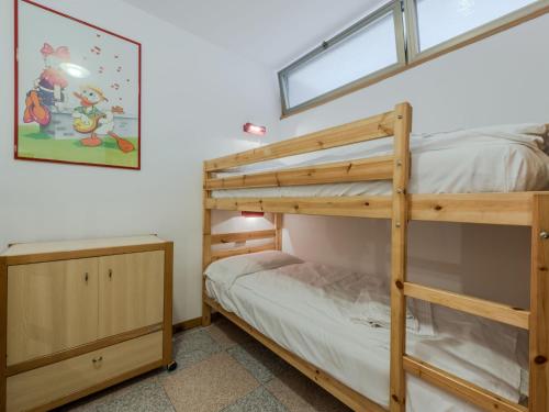 a bedroom with two bunk beds and a window at Apartment La Casa dei Frassini by Interhome in Strembo