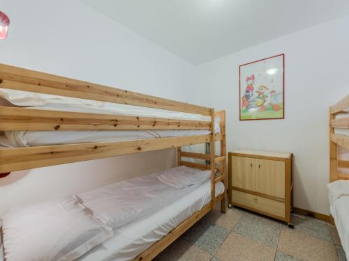 a couple of bunk beds in a room at Apartment La Casa dei Frassini by Interhome in Strembo