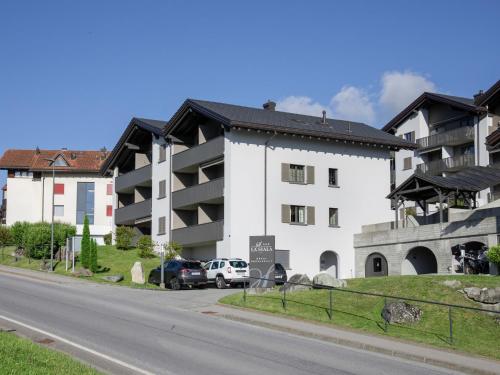 a large white building on the side of a road at Apartment La Siala Apt-51 by Interhome in Falera
