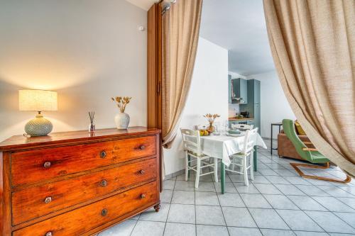 a dining room with a dresser and a dining table at Umbria Casavacanze in Montefranco
