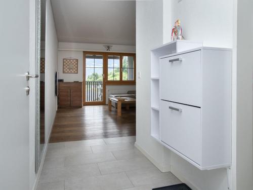 a hallway with white cabinets in a house at Apartment La Siala Apt-52 by Interhome in Falera