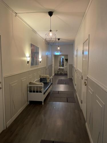 a hallway with a living room with a couch at Högsnäsgården in Överhörnäs