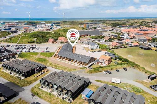 an aerial view of a city with a windmill at 782-Hvide-Sande-Norregade-2-nr-25 in Hvide Sande