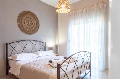Ένα ή περισσότερα κρεβάτια σε δωμάτιο στο Olympus Olea Villa