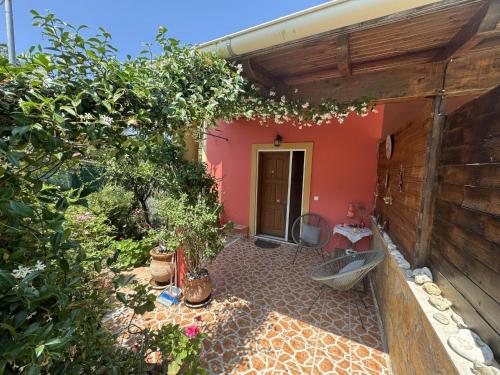 an outside view of a house with a garden at Ilias in Paramonas