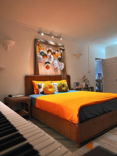a bedroom with a bed with bowls on the wall at Horizon Home - Netflix n Chill in Ho Chi Minh City