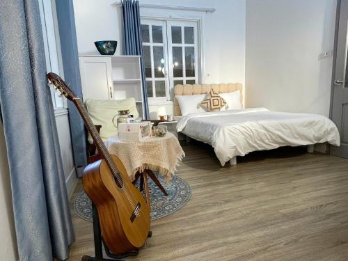 Ein Bett oder Betten in einem Zimmer der Unterkunft CHARM CHARM - kimmy housing - 48 To Ngoc Van