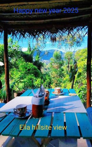 a blue picnic table with food and drinks on it at The view in Ella