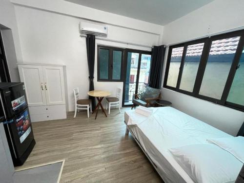 Ein Bett oder Betten in einem Zimmer der Unterkunft CHARM CHARM - kimmy housing - 48 To Ngoc Van