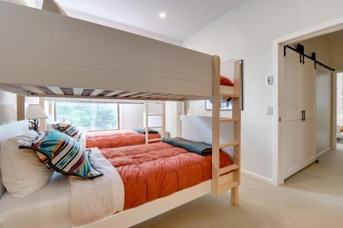 a bedroom with a bunk bed and a ladder at Ski-InandSki-Out Sugarbush Retreat with Indoor Hot Tub in Warren