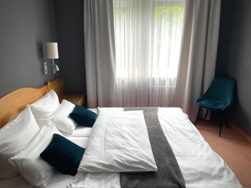 Uma cama ou camas num quarto em Hotel Tari