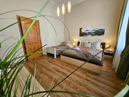 a bedroom with a bed and a door in it at Avocado Old Town 2BR Spacious Apartment near Dome Square in Rīga