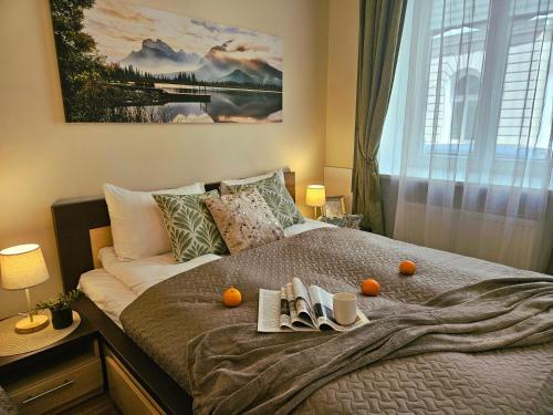 a bedroom with a bed with oranges on it at Avocado Old Town 2BR Spacious Apartment near Dome Square in Rīga
