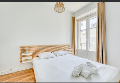 Postel nebo postele na pokoji v ubytování appartement cœur de Nantes