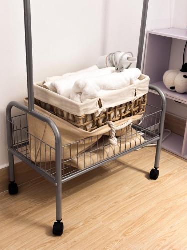 a metal bed cart with towels on top of it at Horizon Home - Netflix n Chill in Ho Chi Minh City