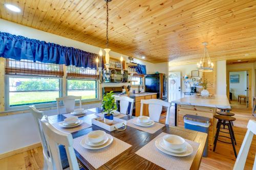 a kitchen and dining room with a table and chairs at Near Table Rock Lake Family Home with Deck and Views in Golden