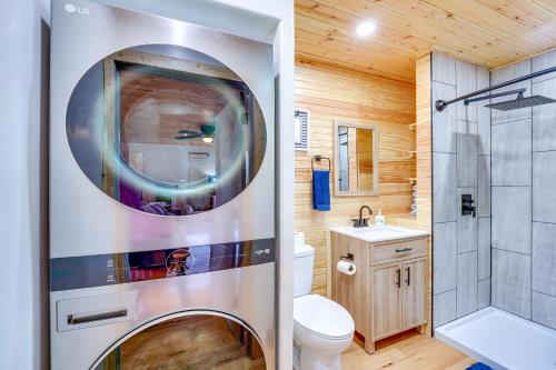 a bathroom with a toilet and a shower at Near Table Rock Lake Family Home with Deck and Views in Golden