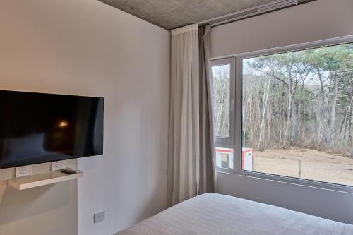 TV a/nebo společenská místnost v ubytování Almarena La Reserva