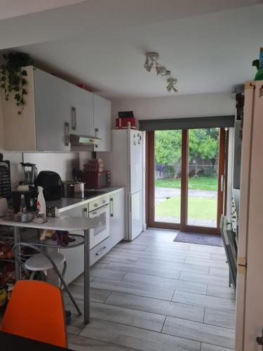 a kitchen with a door open to a yard at Drimnagh House in Dublin