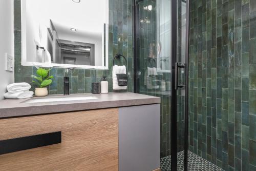 a bathroom with a sink and a shower at 3BR3Bth Penthouse 2 Parking Spaces TD MIT Harvard in Somerville