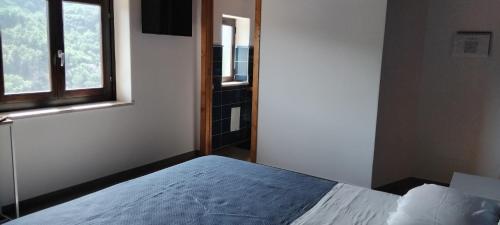 a bedroom with a bed and a window at Contrada Cafaro in Salerno