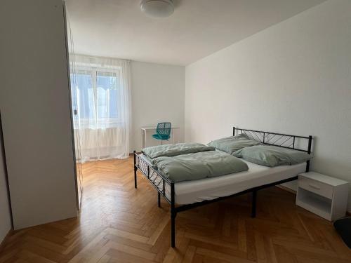 a bedroom with a bed in a room at SeeZeit Friedrichshafen in Friedrichshafen