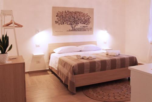 Ένα ή περισσότερα κρεβάτια σε δωμάτιο στο Radici Rooms