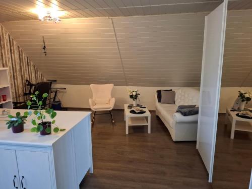 a living room with a couch and a table at Dixiland in Tauche