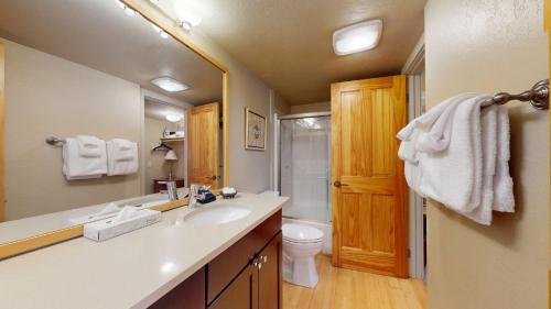 a bathroom with a sink and a toilet at Crestview Condo 25 in Ketchum