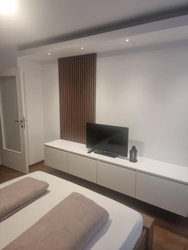 Llit o llits en una habitació de Apartman Katedrala