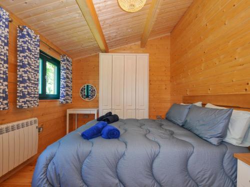 Ένα ή περισσότερα κρεβάτια σε δωμάτιο στο Owl Lodge