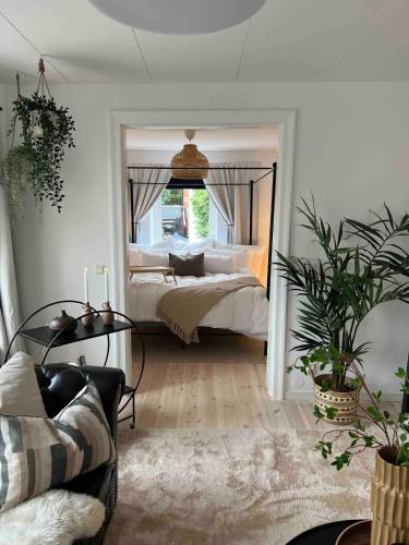 a bedroom with a bed and a large mirror at Fully Equipped Cosy Flat Close to Malmö&Copenhagen in Vellinge