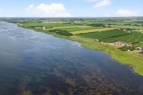 an aerial view of a river with green fields at 1173-Ringkobing-Jagtvej-34-C-lejl-4 in Ringkøbing