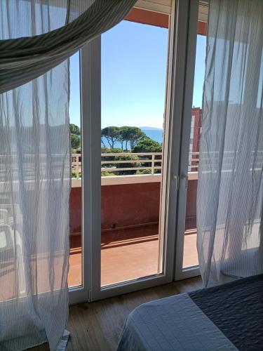 Ένα ή περισσότερα κρεβάτια σε δωμάτιο στο Appartamento VISTA MARE