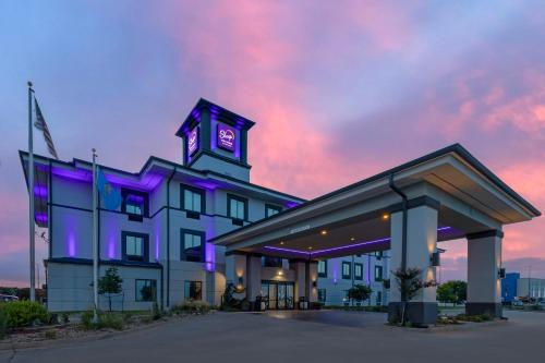 a building with a clock tower on top of it at Sleep Inn & Suites Norman near University in Norman