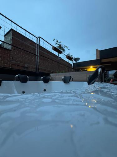 a close up of the front of a car with the water at Hostel43 in Estación El Salto