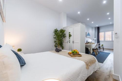 Postel nebo postele na pokoji v ubytování Deluxe Signature Studio - Malaga Center